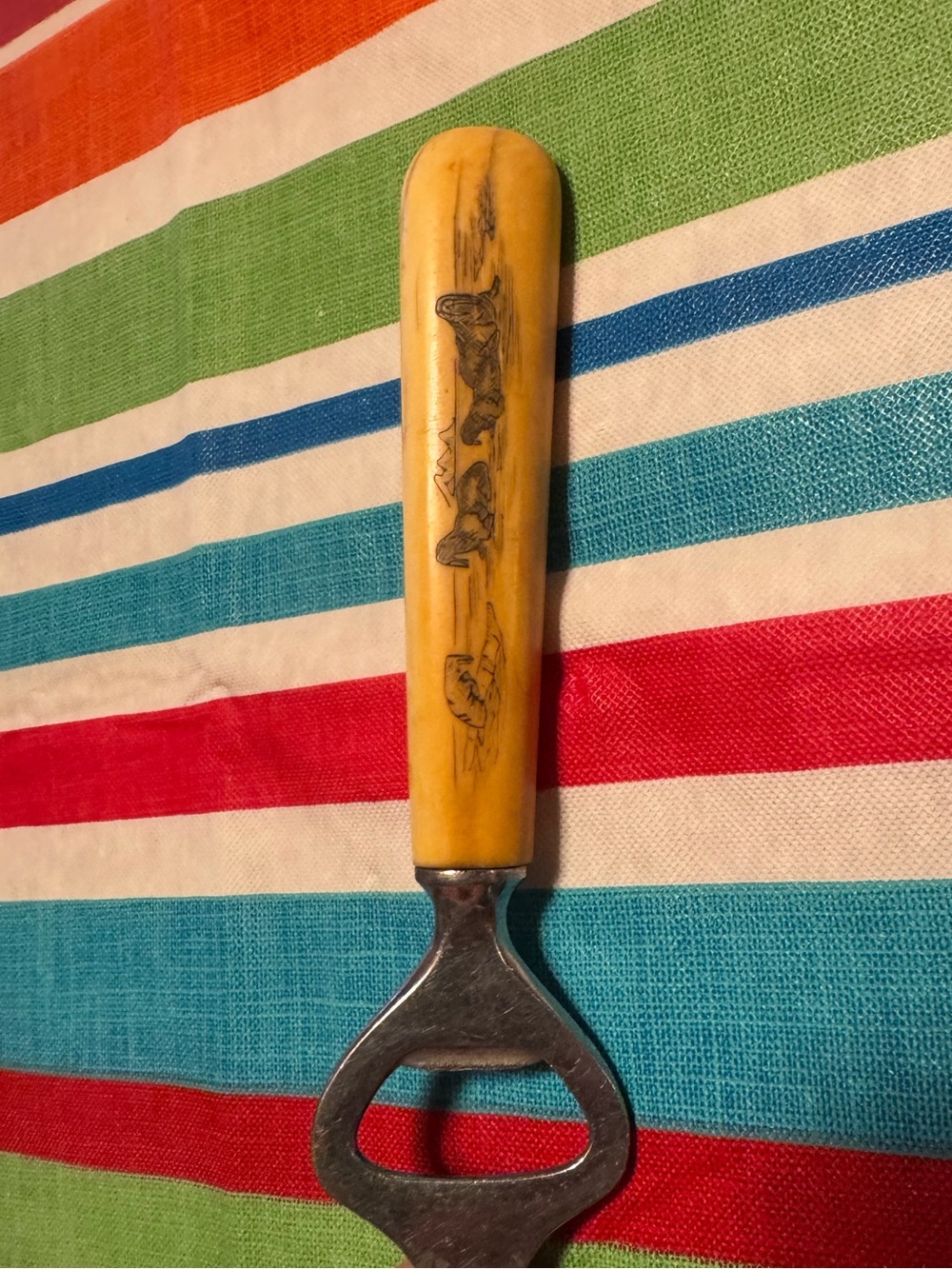 Vintage Decorative Yellow Handle Bottle Opener with Etched Walrus Motif